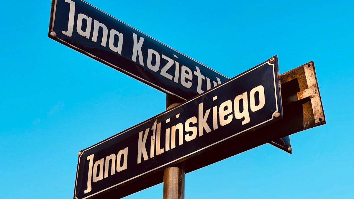 a close up of a street sign on a pole